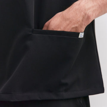 Close-up of front pocket on Allscrubs Men’s Zen Scrub Top in black