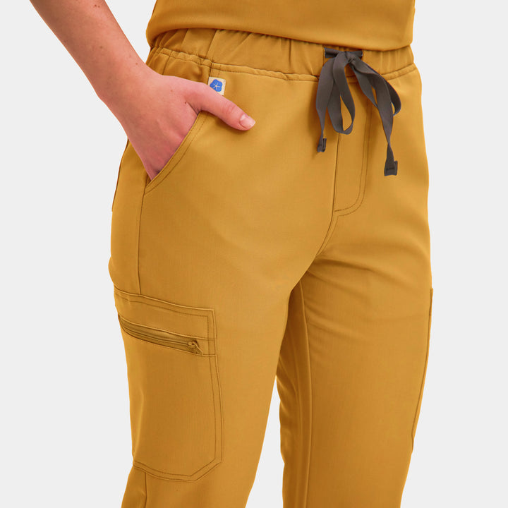 Front view of Allscrubs Women's Mild Cargo Scrub Pants in Amber