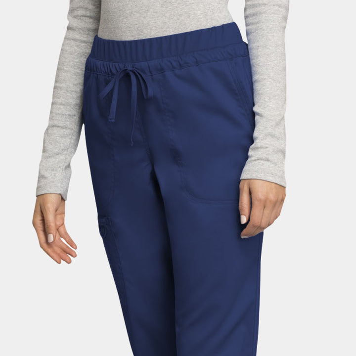 Close-up of front waist and pocket details on navy Cherokee WW105 scrub pants