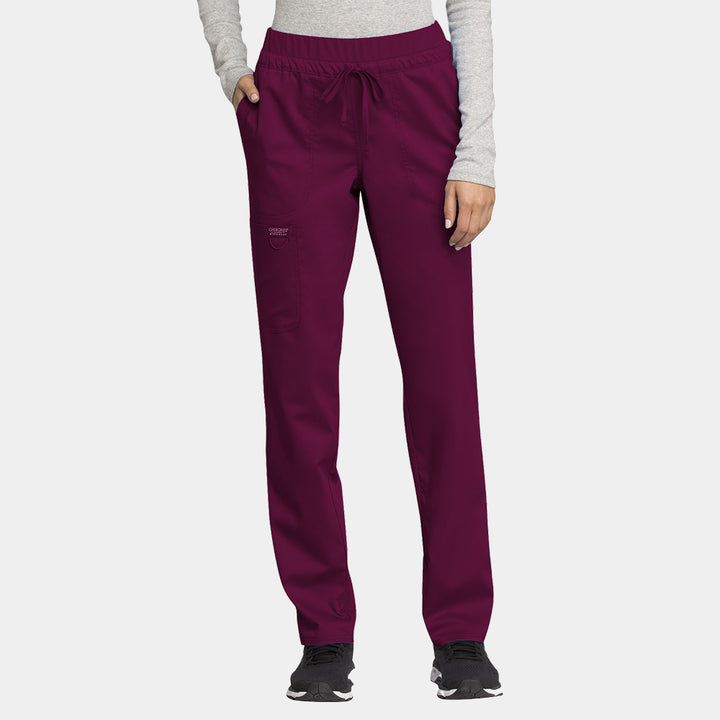 Front view of Cherokee Revolution WW105 women’s tapered drawstring scrub pants in wine