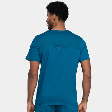 Back view of Cherokee Revolution WW603 men’s v-neck scrub top in Caribbean color