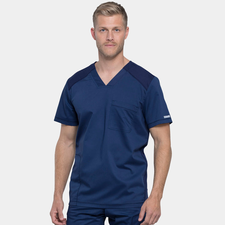 Front view of Cherokee Revolution WW603 men’s v-neck scrub top in navy