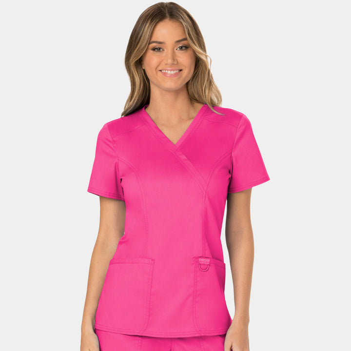 Front view of Cherokee Revolution WW610 women’s mock wrap scrub top in Electric Pink
