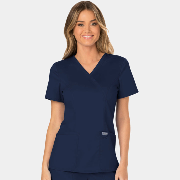 Front view of Cherokee Revolution WW610 women’s mock wrap scrub top in Navy