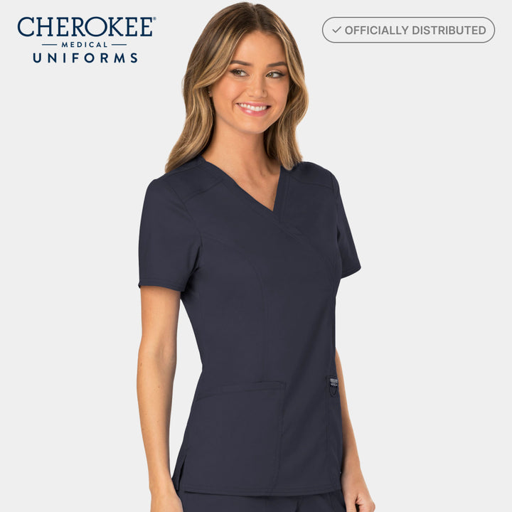 Half side view of Cherokee Revolution WW610 women’s mock wrap scrub top in pewter