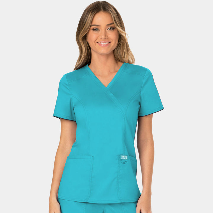 Front view of Cherokee Revolution WW610 women’s mock wrap scrub top in Turquoise