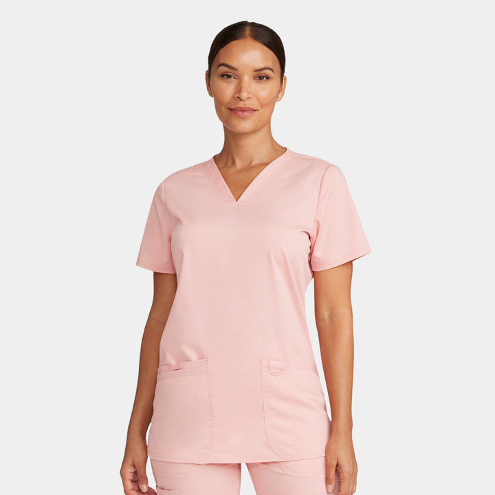 Front view of Cherokee Revolution WW620 women’s v-neck scrub top in Pink Essence