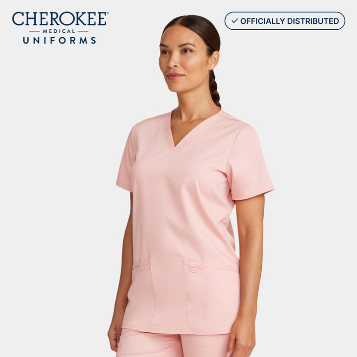 Side view of Cherokee Revolution WW620 women’s v-neck scrub top in Pink Essence