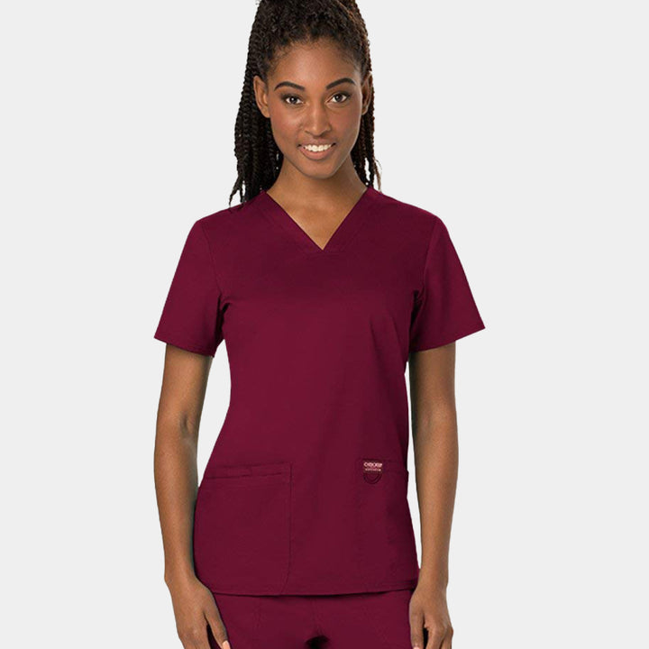 Front view of Cherokee Revolution WW620 women’s v-neck scrub top in Wine