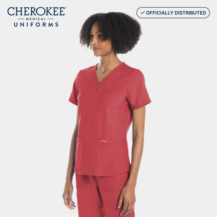 Side view of Cherokee Workwear Originals Ultra CK961A women's V-neck scrub top in Spiced Coral