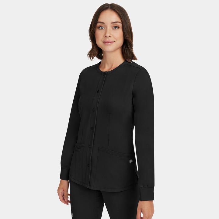 Half-side view of Healing Hands Megan women's black button front scrub jacket showing fit and design